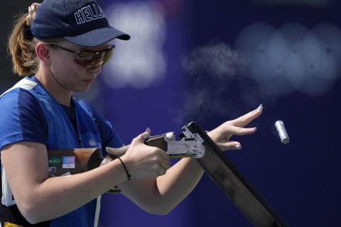 Greece's Emmanouela Katzouraki ejects empty cartridges from her gun as she competes in the Skeet women's final at the 2024 Summer Olympics, Sunday, Aug. 4, 2024, in Chateauroux, France. (AP Photo/Manish Swarup)