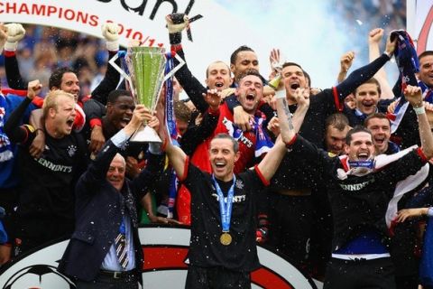 KILMARNOCK, SCOTLAND - MAY 15:  Walter Smith and David Weir of Rangers lift the Scottish Premier League trophy after winning the Clydesdale Bank Premier League at Rugby Park on May 15, 2011 in Kilmarnock, Scotland..  (Photo by Jeff J Mitchell/Getty Images)