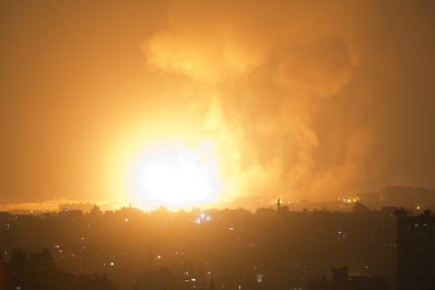 An explosion caused by Israeli airstrikes on Gaza City, early Thursday, Aug. 9, 2018. Israel struck targets in the Gaza Strip after dozens of rockets were launched Wednesday from the coastal territory ruled by the Islamic militant Hamas group, the Israeli military said. (AP Photo/Khalil Hamra)