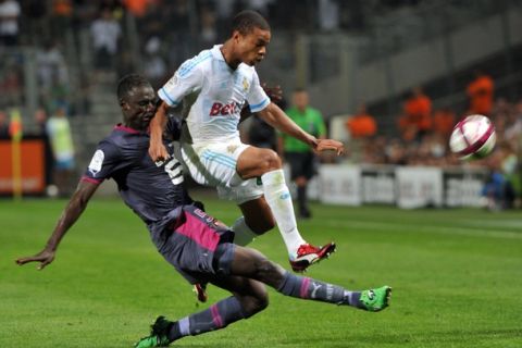 Marseille's French forward Loic Remy (R) vies with Rennes' Senagalese defender and captain Kader Mangane (L) during their French L1 football match Olympique of Marseille versus Rennes on September 10, 2011 at the Velodrome stadium in Marseille, southern France.       AFP PHOTO/GERARD JULIEN (Photo credit should read GERARD JULIEN/AFP/Getty Images)