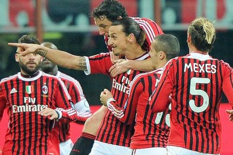 Swedish forward of Milan, Zlatam Ibrahimovic (C), celebrated by his teammates after scoring the goal during the Italian Serie A soccer match AC Milan vs Cagliari Calcio at Giuseppe Meazza stadium in Milan, Italy on 29 January 2012.
ANSA/DANIEL DAL ZENNARO