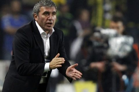 Galatasaray's new coach Gheorghe Hagi of Romania reacts during their Turkish Super League derby soccer match against Fenerbahce at Sukru Saracoglu stadium in Istanbul October 24, 2010. REUTERS/Murad Sezer (TURKEY - Tags: SPORT SOCCER)