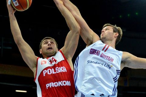 Great Britain's Joel Freeland (R) and Poland's Adam Hrycaniuk fight for the ball during the group A qualification match between Great Britain and Poland during the EuroBasket2011 in Panevezys on September 5,2011.AFP PHOTO/JOE KLAMAR (Photo credit should read JOE KLAMAR/AFP/Getty Images)