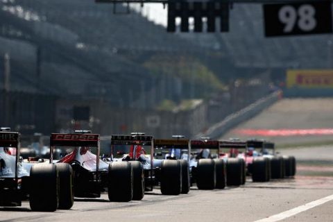 SHANGHAI, CHINA - APRIL 12:  Cars line up on the grid before the Formula One Grand Prix of China at Shanghai International Circuit on April 12, 2015 in Shanghai, China.  (Photo by Clive Mason/Getty Images)