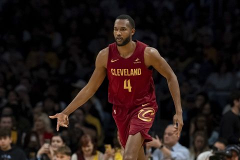 Cleveland Cavaliers forward Evan Mobley (4) reacts after making a 3-point shot during the first half of an NBA basketball game against the Los Angeles Lakers, Saturday, April 6, 2024, in Los Angeles. (AP Photo/William Liang)