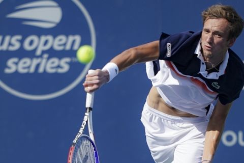 Daniil Medvedev, of Russia, serves to David Goffin, of Belgium, in the men's final match during the Western & Southern Open tennis tournament Sunday, Aug. 18, 2019, in Mason, Ohio. (AP Photo/John Minchillo)