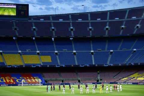 FILE - Players observe a moments silence before the Champions League round of 16, second leg soccer match between Barcelona and Napoli at the Camp Nou Stadium in Barcelona, Spain, Saturday, Aug. 8, 2020. (AP Photo/Joan Monfort, File)