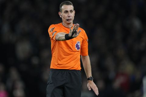 Referee David Coote reacts during the English Premier League soccer match between Tottenham Hotspur and Brighton and Brentford , at White Hart Lane Stadium in London, England, Wednesday , Jan 31, 2024. (AP Photo/Dave Shopland)