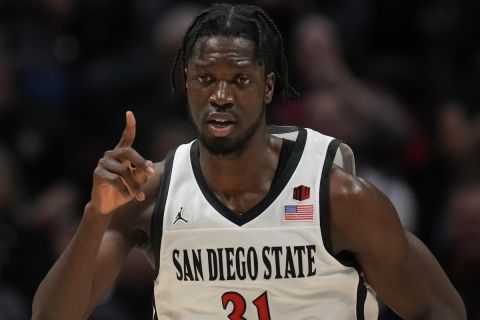 San Diego State forward Nathan Mensah reacts after a basket during the second half of an NCAA college basketball game against Nevada, Tuesday, Jan. 10, 2023, in San Diego. (AP Photo/Gregory Bull)