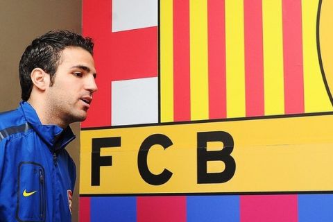 (FILES) This file picture taken on March 7, 2011 shows Arsenal's Spanish midfielder Cesc Fabregas arriving for a press conference at Barcelona FC's Nou Camp stadium, ahead of their Champions League football match against Barcelona FC on March 8. Arsenal have abandoned efforts to keep skipper Cesc Fabregas who could be set for a return to Spanish giants Barcelona, Spanish sports newspapers said Thursday June 9, 2011. Gunners coach Arsene Wenger has allowed his skipper to leave on condition he does not sign with another English team, the Barcelona-based daily Mundo Deportivo said, quoting a conversation between the two. AFP PHOTO/Carl de Souza/FILES (Photo credit should read CARL DE SOUZA/AFP/Getty Images)