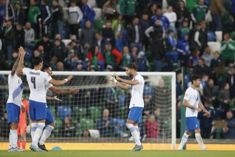 Greece's team players celebrate as they won the UEFA Nations League soccer match between Northern Ireland and Greece, at Windsor Park stadium in Belfast, Northern Ireland, Thursday, June 2, 2022. (AP Photo/Peter Morrison)