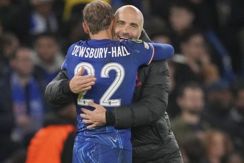 Chelsea's head coach Enzo Maresca embraces Chelsea's Kiernan Dewsbury-Hall after the Europa Conference League opening phase soccer match between Chelsea and Gent at Stamford Bridge in London, Thursday, Oct. 3, 2024. (AP Photo/Kin Cheung)