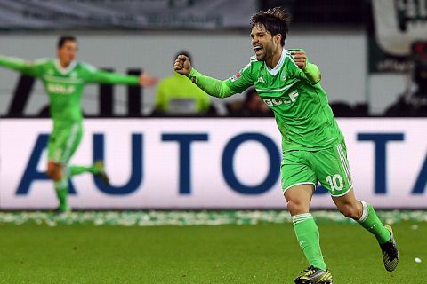 WOLFSBURG, GERMANY - NOVEMBER 11:  Diego of Wolfsburg celebrates during the Bundesliga match between VfL Wolfsburg and Bayer 04 Leverkusen at Volkswagen Arena on November 11, 2012 in Wolfsburg, Germany.  (Photo by Martin Rose/Bongarts/Getty Images)