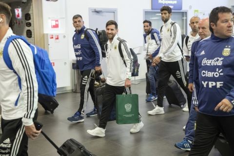 Lionel Messi, center, walks as the Argentina national soccer team arrive at Zhukovsky international airport outside Moscow, Russia, Saturday, June 9, 2018 to compete in the 2018 World Cup in Russia. The 21st World Cup begins on Thursday, June 14, 2018, when host Russia takes on Saudi Arabia. (AP Photo/Pavel Golovkin)