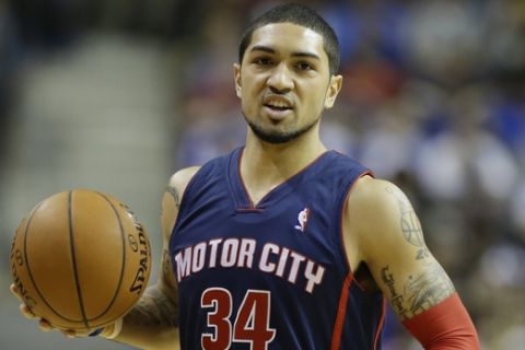 Detroit Pistons guard Peyton Siva (34) controls the ball during the first half of an NBA basketball game against the Toronto Raptors in Auburn Hills, Mich., Sunday, April 13, 2014. (AP Photo/Carlos Osorio)