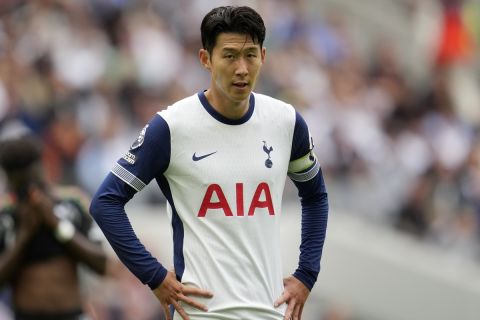 Tottenham's Son Heung-min stands on the pitch during the English Premier League soccer match between Tottenham Hotspur and Arsenal in London, Sunday, Sept. 15, 2024. (AP Photo/Kin Cheung)