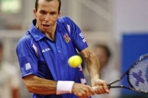 Czech Republic's Radek Stepanek returns the ball to Croatia's Ivo Karlovic during their Davis Cup semifinal tennis match in  Porec, Croatia, Friday Sept. 18, 2009. (AP Photo/Darko Bandic)