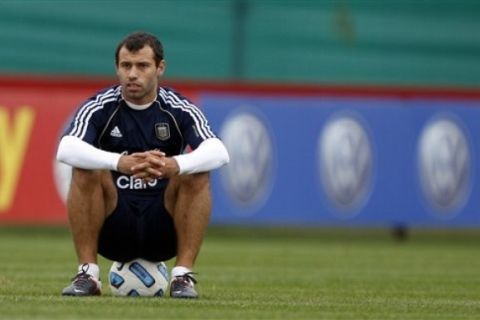 Argentina's Javier Mascherano sits on the ball during a training session in Buenos Aires, Argentina, Friday, June 17, 2011. Argentina will host the 2011 Copa America soccer tournament July 1-24.  (AP Photo/Natacha Pisarenko)