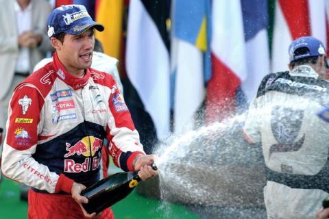 France's rally driver Sebastien Ogier sprays champagne on October 2, 2011, during the third stage of France?s Rallye Alsace, in Strasbourg, eastern France. Ogier won the rally ahead of Spain's driver Daniel Sordo and Norway's driver Petter Solberg.   AFP PHOTO / PATRICK HERTZOG (Photo credit should read PATRICK HERTZOG/AFP/Getty Images)