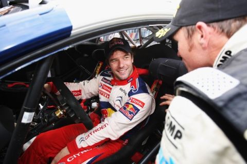 CARDIFF, WALES - OCTOBER 25:  Petter Solberg of Norway congratulates Sebastien Loeb of France and Citroen on winning the World Rally Championship and the 2009 Wales Rally GB on October 25, 2009 in Cardiff, Wales.  (Photo by Bryn Lennon/Getty Images)