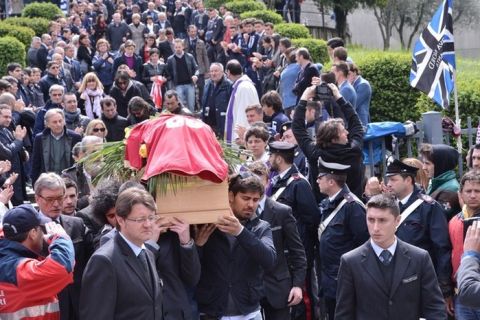 Family and friends of footballer Piermario Morosini follow his coffin after the funeral service at a church on April 19, 2012  in Bergamo.  The 25-year-old, who played for second division team Livorno and was on loan from Udinese, died during a match at Pescara on April 14. AFP PHOTO / GIUSEPPE CACACE (Photo credit should read GIUSEPPE CACACE/AFP/Getty Images)