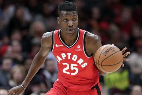 Toronto Raptors' Chris Boucher drives against the Cleveland Cavaliers in the second half of an NBA basketball game, Monday, March 11, 2019, in Cleveland. (AP Photo/Tony Dejak)