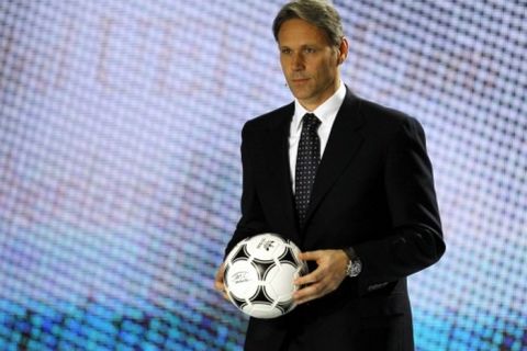 epa03022311 Marco van Basten, former Dutch striker and member of the Dutch team that won the 1988 European Championships appears on stage during the UEFA EURO 2012 draw ceremony in Kiev, Ukraine, 02 December 2011.  EPA/SERGEY DOLZHENKO