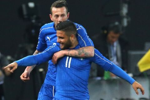 Italys Lorenzo Insigne, foreground, celebrates with teammate Federico Bernadeschi after scoring during a friendly soccer match between Italy and Spain, at the Friuli Dacia Arena stadium in Udine, Italy, Thursday, March 24, 2016. (AP Photo/Paolo Giovannini)