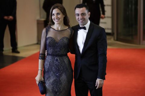 Barcelona FC player Xavier Hernandez, right, poses for a photo with his wife Nuria Cunillera, as they arrive to attend the wedding of Lionel Messi and Antonella Roccuzzo, in Rosario, Argentina, Friday, June 30, 2017. Some 260 guests, including teammates and former teammates of the Barcelona soccer star, are attending the highly anticipated ceremony. (AP Photo/Victor R. Caivano)