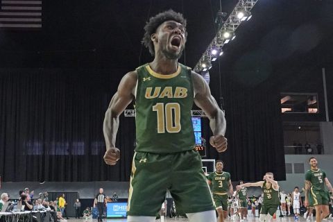 UAB guard Jordan Walker (10) reacts to hitting a basket late in the second half of an NCAA college basketball game against Middle Tennessee in the semifinal round of the Conference USA tournament in Frisco, Texas, Friday, March 11, 2022. (AP Photo/LM Otero)