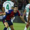 Barcelona's Robert Lewandowski, center, celebrates with Barcelona's Jules Kounde, front, after scoring the opening goal during a Spanish La Liga soccer match between Barcelona and Getafe at the Olympic stadium in Barcelona, Spain, Wednesday, Sept. 25, 2024. (AP Photo/Joan Monfort)