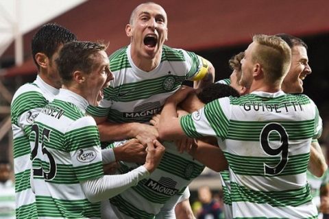 30/11/14 WILLIAM HILL SCOTTISH CUP 4TH RND
HEARTS v CELTIC 
TYNECASTLE
Celtic's Virgil van Dijk (bottom centre) is surrounded by his team-mates having opened the scoring to put his side 0-1 to the good