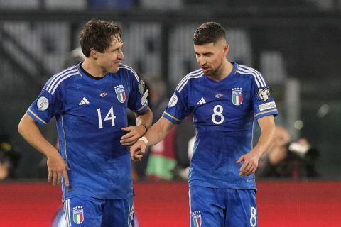 Italy's Federico Chiesa, left, celebrates with his teammate Jorginho after scoring his sides second goal during an Euro 2024 group C qualifying soccer match between Italy and North Macedonia, at the Olympic Stadium stadium in Rome Friday, Nov. 17, 2023. (AP Photo/Andrew Medichini)