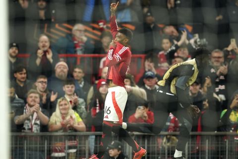 Manchester United's Amad Diallo celebrates after scoring the opening goal during the Europa League opening phase soccer match between Manchester United and PAOK at the Old Trafford stadium in Manchester, England, Thursday, Nov. 7, 2024. (AP Photo/Dave Thompson)