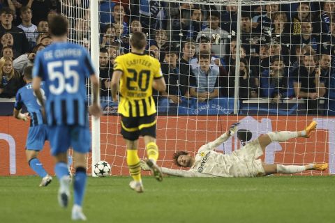 Dortmund's goalkeeper Gregor Kobel jumps for the ball during the Champions League opening phase soccer match between Club Brugge and Borussia Dortmund at Jan Breydelstadion in Bruges, Belgium, Wednesday, Sept. 18, 2024. (AP Photo/Omar Havana)