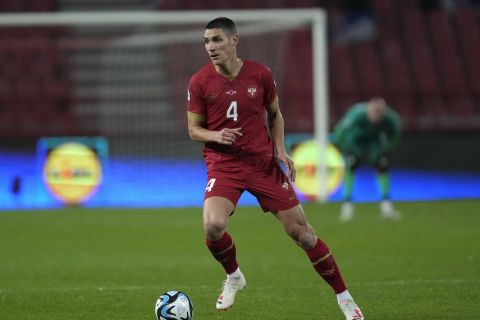 Serbia's Nikola Milenkovic controls the ball during the Euro 2024 group G qualifying soccer match between Serbia and Montenegro, at the Rajko Mitic Stadium in Belgrade, Serbia, Tuesday, Oct. 17, 2023. (AP Photo/Darko Vojinovic)