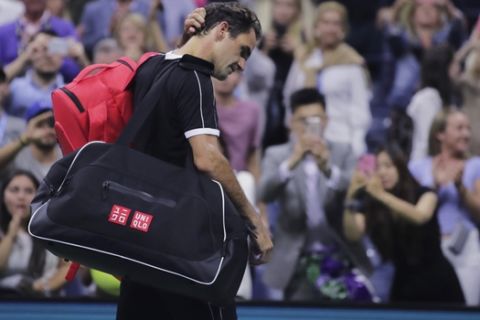 Roger Federer, of Switzerland, scratches his head as he walks off the court after a loss to Grigor Dimitrov, of Bulgaria, during the quarterfinals of the U.S. Open tennis tournament Tuesday, Sept. 3, 2019, in New York. Dimitrov won 3-6, 6-4, 6-3, 6-4, 6-2. (AP Photo/Charles Krupa)