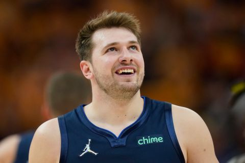 Dallas Mavericks guard Luka Doncic (77) looks on in the second half of Game 4 of an NBA basketball first-round playoff series, against the Utah Jazz Saturday, April 23, 2022, in Salt Lake City. (AP Photo/Rick Bowmer)