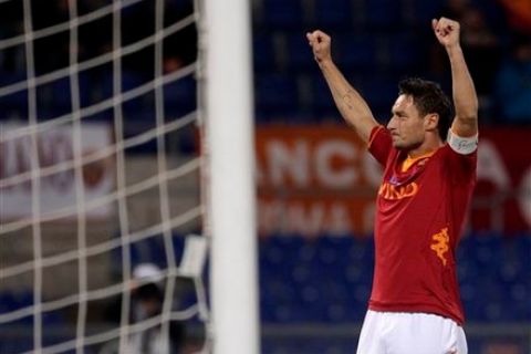 AS Roma forward Francesco Totti celebrates after scoring his second goal during a Serie A soccer match between AS Roma and Cesena, at Rome's Olympic stadium, Saturday, Jan. 21, 2012. (AP Photo/Riccardo De Luca)