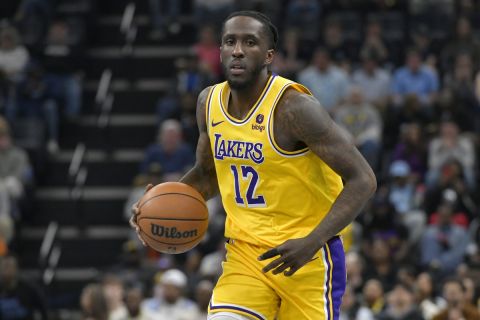 Los Angeles Lakers forward Taurean Prince (12) handles the ball in the first half of an NBA basketball game against the Memphis Grizzlies Wednesday, March 27, 2024, in Memphis, Tenn. (AP Photo/Brandon Dill)
