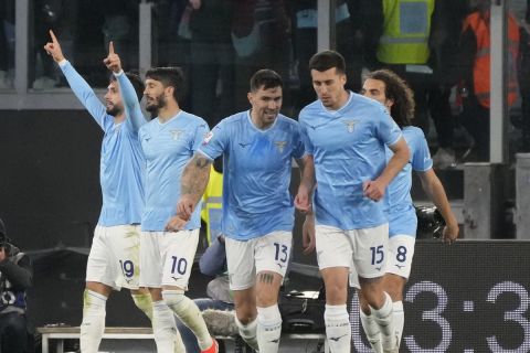 Lazio's Taty Castellanos, left, celebrates after scoring his side's second goal during the Italian Cup semi-final soccer match between Lazio and Juventus at Rome's Olympic Stadium, Italy, Tuesday, April 23, 2024. (AP Photo/Gregorio Borgia)