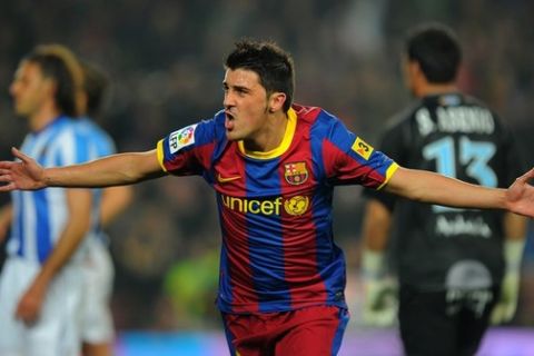 Barcelona's forward David Villa celebrates after scoring a goal during the Spanish league football match FC Barcelona vs Malaga CF on January 16, 2011 at the Camp Nou stadium in Barcelona.    AFP PHOTO/ LLUIS GENE (Photo credit should read LLUIS GENE/AFP/Getty Images)