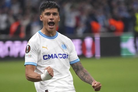 Marseille's Joaquin Correa celebrates after scoring during a penalty shootout at the end of the Europa League quarter final second leg soccer match between Olympique de Marseille and SL Benfica at the Velodrome stadium in Marseille, south of France, Thursday, April 18, 2024. (AP Photo/Daniel Cole)