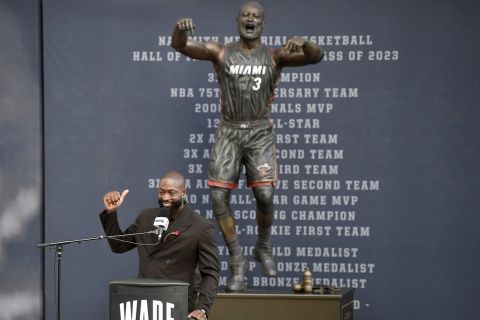 Former Miami Heat NBA basketball player Dwyane Wade speaks during his statue unveiling ceremony outside Kaseya Center, Sunday, Oct. 27, 2024, in Miami, Fla. (AP Photo/Michael Laughlin)