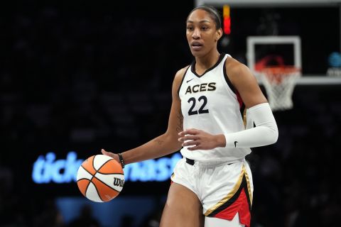 FILE - Las Vegas Aces' A'ja Wilson (22) looks to pass during the first half in Game 3 of a WNBA basketball final playoff series against the New York Liberty Sunday, Oct. 15, 2023, in New York. The Two-time WNBA MVP is getting a Nike signature shoe, in a deal that was announced Saturday, May 11, 2024. (AP Photo/Frank Franklin II, File)