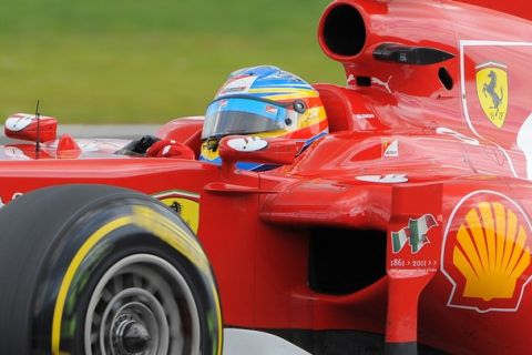 Ferrari's Spanish driver Fernando Alonso drives at the Silverstone circuit on July  9, 2011 during the qualifying session of the of the Formula One Grand Prix.   AFP PHOTO / ANDREW YATES (Photo credit should read ANDREW YATES/AFP/Getty Images)