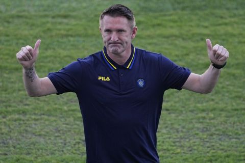 Former Ireland soccer great Robbie Keane poses for photographers in Tel Aviv, Israel, Tuesday, June 27, 2023. Keane has been hired to coach Israeli soccer club Maccabi Tel Aviv. (AP Photo/Ariel Schalit)