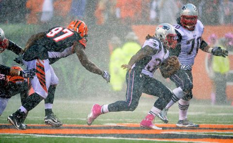 Oct 6, 2013; Cincinnati, OH, USA; New England Patriots running back Brandon Bolden (38) tries to get away from Cincinnati Bengals defensive tackle Geno Atkins (97) during the second half at Paul Brown Stadium. The Bengals won 13-6.  Mandatory Credit: Marc Lebryk-USA TODAY Sports ORG XMIT: USATSI-132684 ORIG FILE ID:  20131006_jla_bl1_267.jpg