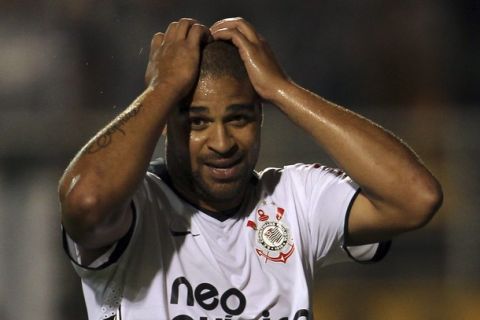 Corinthians' Adriano reacts during their Brazilian championship match against Atletico-GO in Sao Paulo October 9, 2011. REUTERS/Paulo Whitaker (BRAZIL - Tags: SPORT SOCCER)