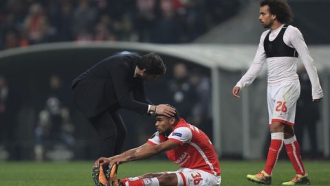 Braga's Bruno Viana is consoled by coach Abel Ferreira at the end of the Europa League round of 32 second leg soccer match between SC Braga and Olympique de Marseille at the Municipal stadium in Braga, Portugal, Thursday, Feb. 22, 2018. Braga won the match 1-0 but lost on aggregate. (AP Photo/Luis Vieira)